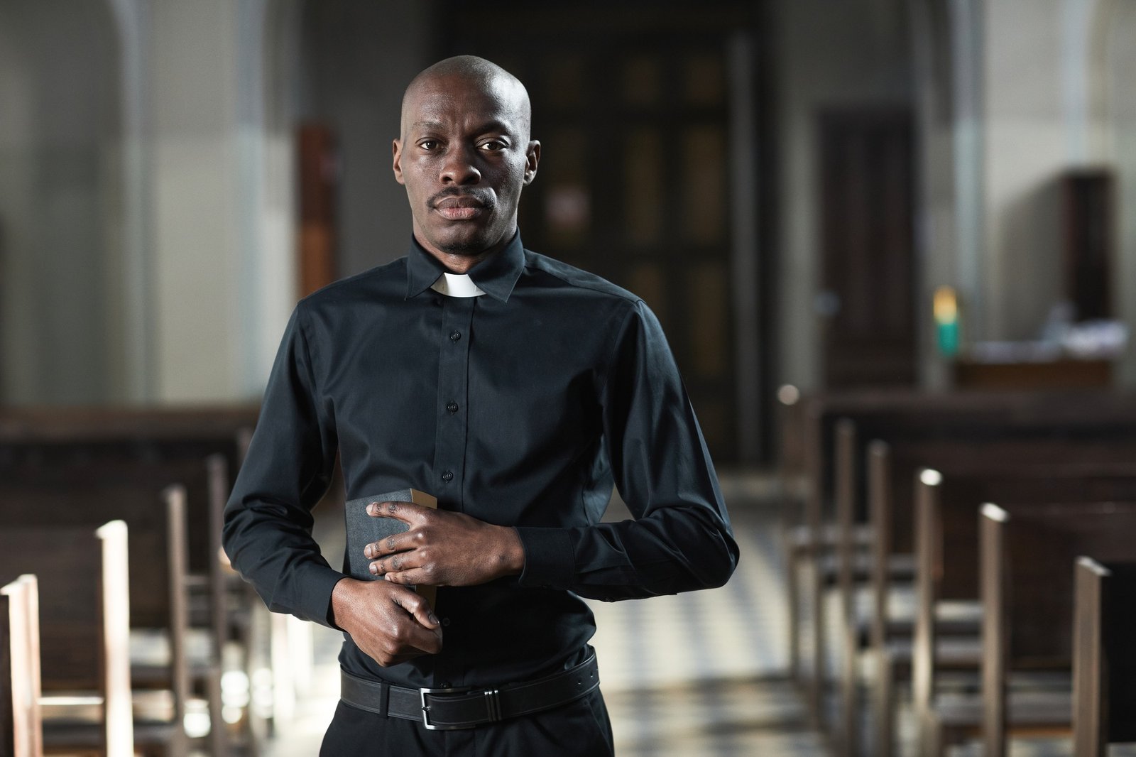 African priest in church